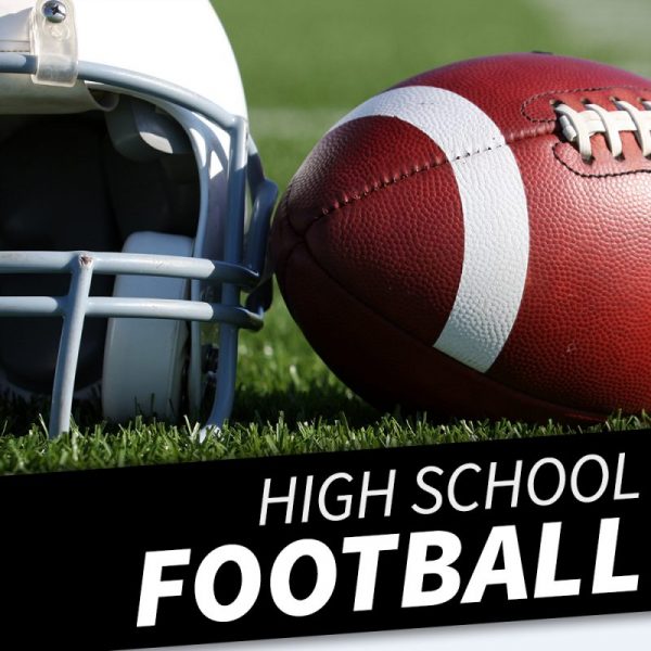 High school football players in action during a game
